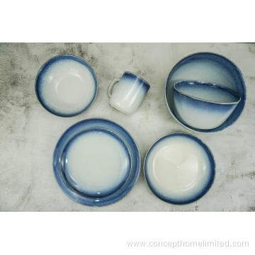 Reactive glazed stoneware dinner set with blue rim